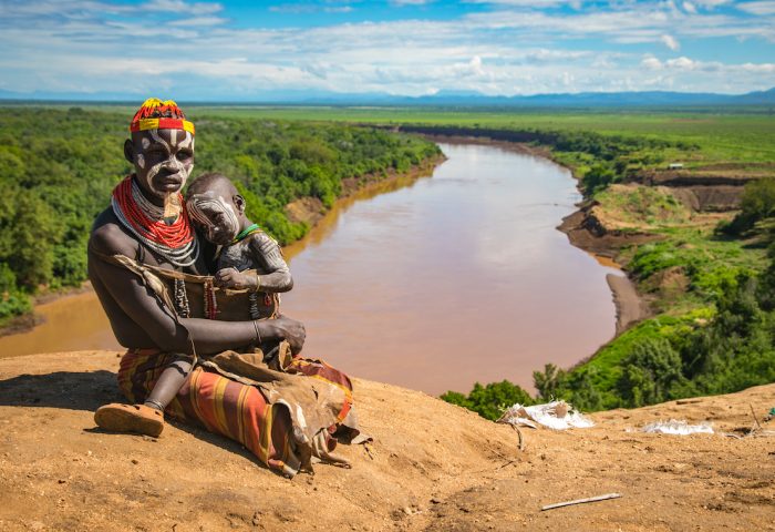 Karo mother and child sitting along the banks of the Omo River in the Kortcho Village.  There is a factory off to the right side of the photo.

Taken in November 2017

Photographer:  Kelly Fogel